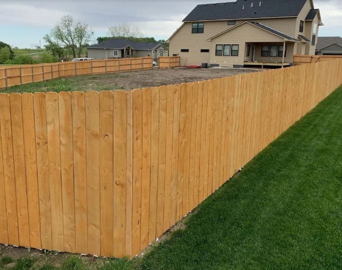 Traditional wooden picket style privacy fence with scalloped design - Matthews, NC