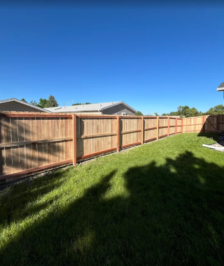 Professional wooden privacy fence installation in residential backyard - Rock Hill, SC